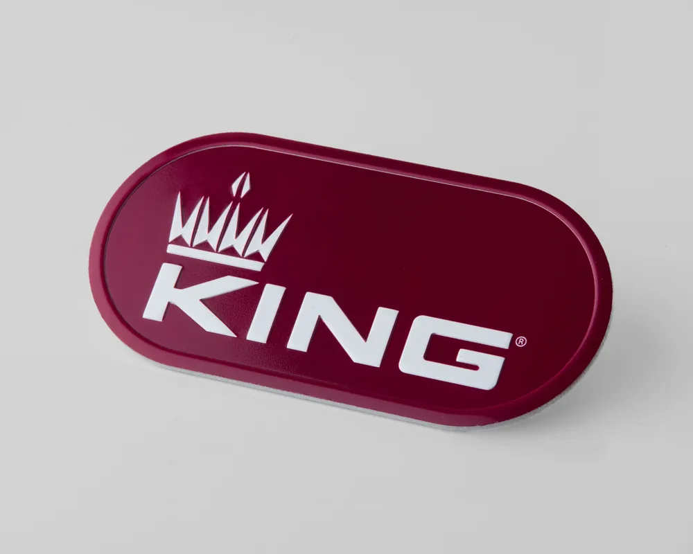 KING aluminum badge with red fill
