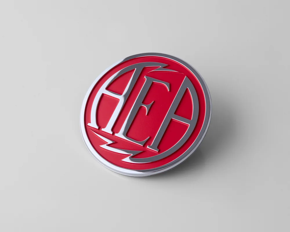 Chrome electroformed badge with red enamel fill