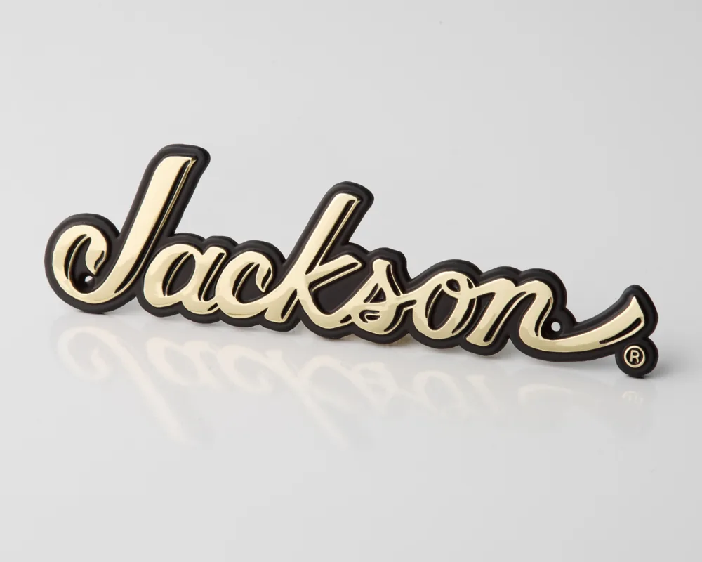 Gold script zinc die-cast logo badge